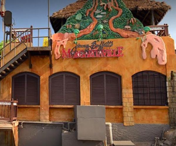 Exterior of Jimmy Buffett’s Margaritaville in Montego Bay, Jamaica, featuring colorful decor and tropical-themed architecture.